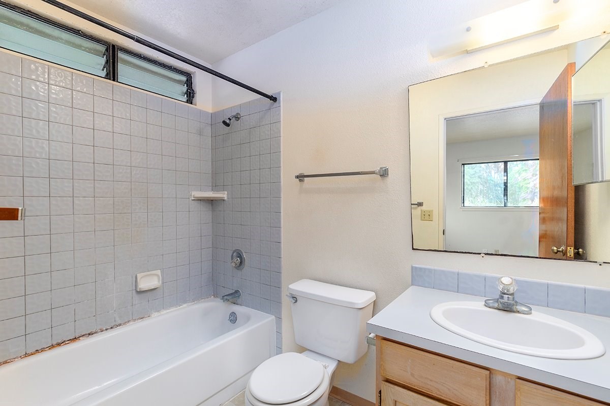 17-4018 Kuaaina Road, Unit 105 Kurtistown, HI 96749 - Photo 8 of 22 a bathroom with a sink toilet and shower