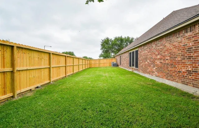 a view of backyard with green space