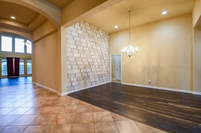 a view of empty room with a bathroom