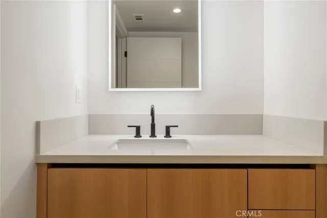 a bathroom with a bathtub and a sink