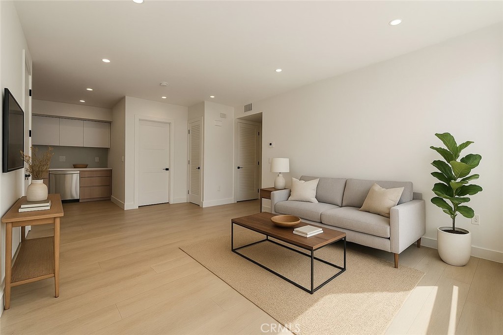 7510 Sepulveda Boulevard, Unit 101 Van Nuys, CA 91405 - Photo 6 of 16 a living room with furniture