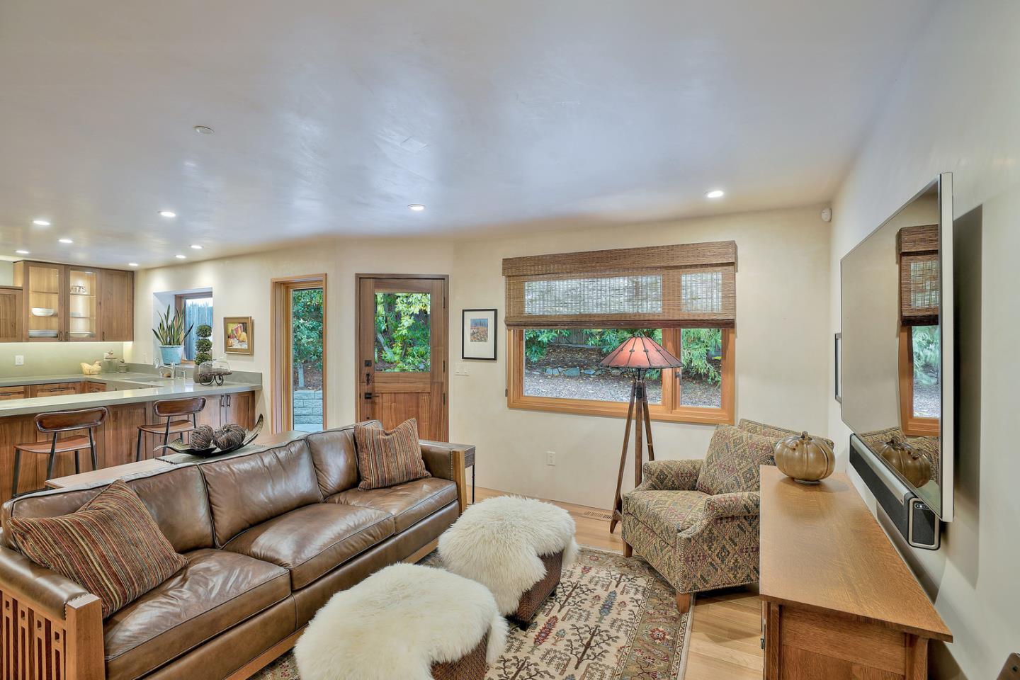 24651 Cabrillo Street Carmel, CA 93923 - Photo 11 of 42 a living room with furniture and a large window