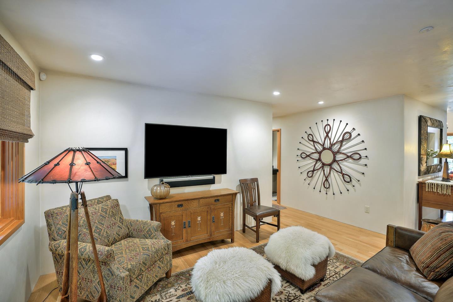 24651 Cabrillo Street Carmel, CA 93923 - Photo 12 of 42 a living room with furniture and a flat screen tv
