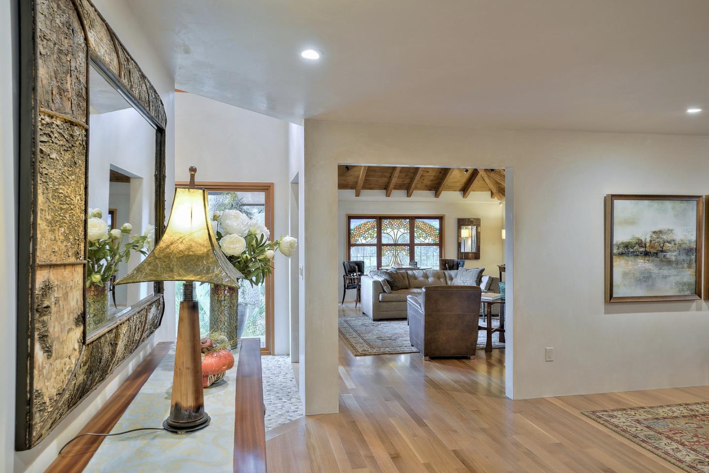 24651 Cabrillo Street Carmel, CA 93923 - Photo 13 of 42 a living room with furniture and a wooden floor