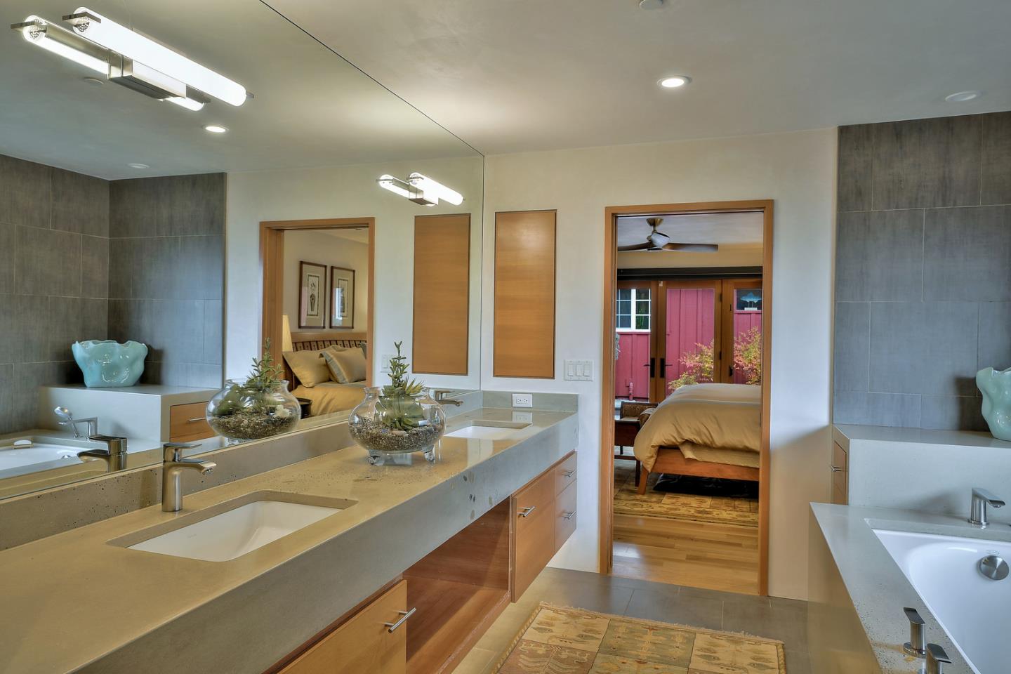 24651 Cabrillo Street Carmel, CA 93923 - Photo 17 of 42 a en suite bathroom with sink and mirror