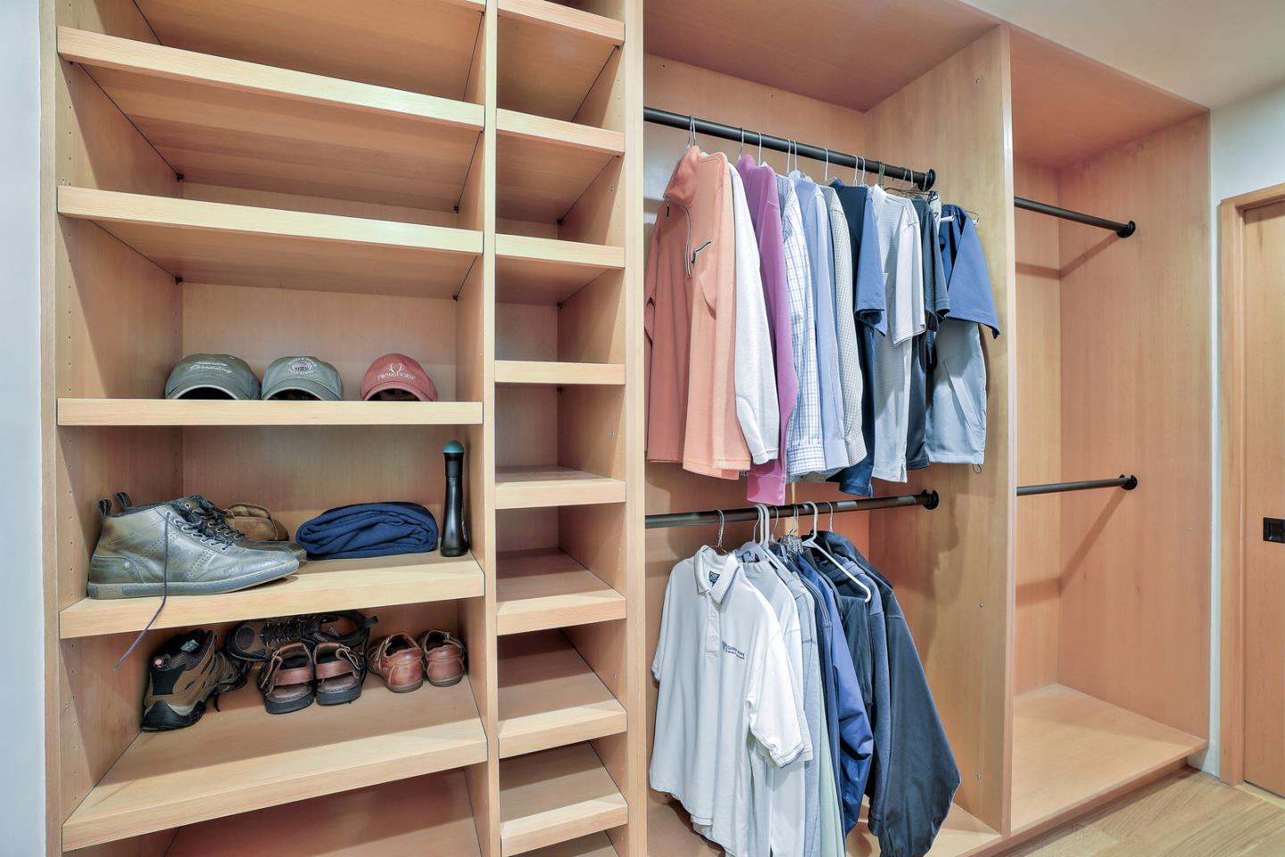 24651 Cabrillo Street Carmel, CA 93923 - Photo 23 of 42 a view of walk in closet with clothes and shoes