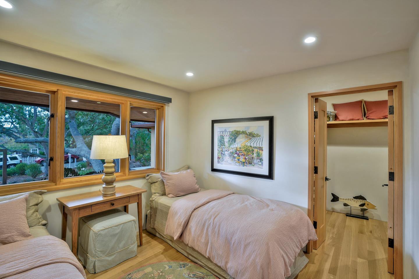24651 Cabrillo Street Carmel, CA 93923 - Photo 24 of 42 a bedroom with a bed and a large window