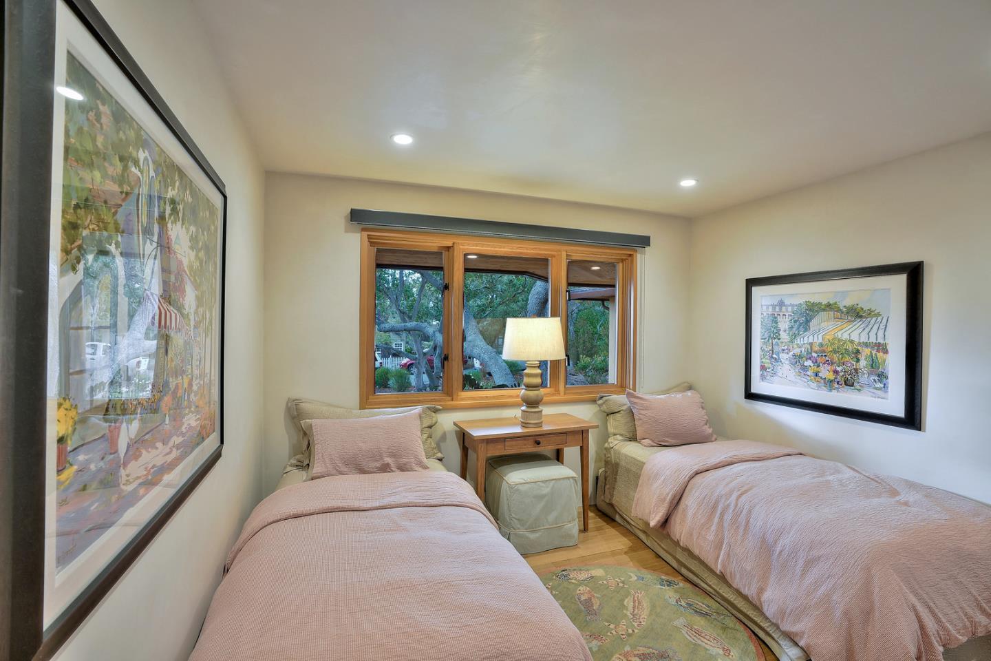 24651 Cabrillo Street Carmel, CA 93923 - Photo 29 of 42 a bed room with a large bed and a large window