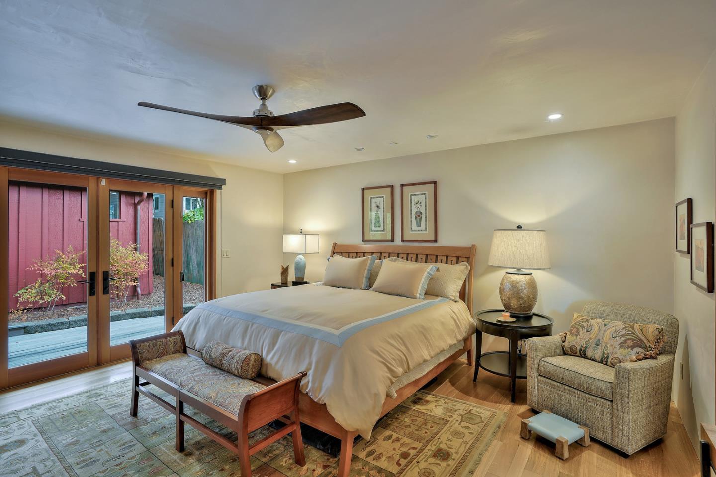 24651 Cabrillo Street Carmel, CA 93923 - Photo 31 of 42 a bedroom with a bed and a couch