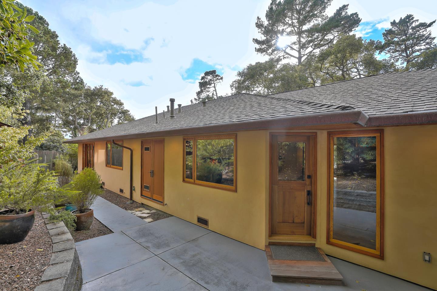 24651 Cabrillo Street Carmel, CA 93923 - Photo 39 of 42 a view of a house with backyard