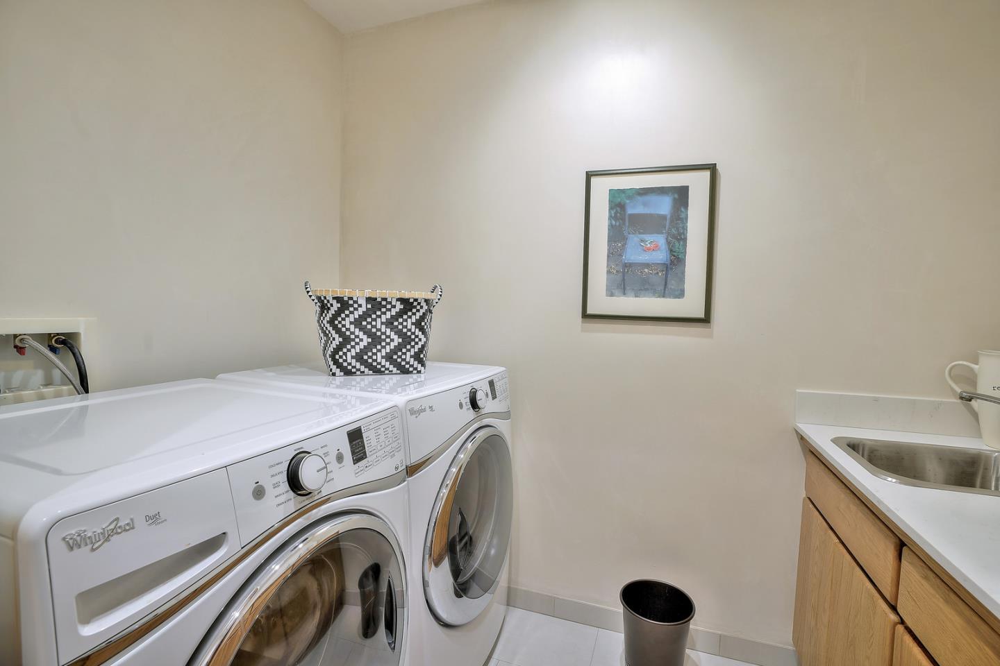24651 Cabrillo Street Carmel, CA 93923 - Photo 40 of 42 a utility room with dryer and washer