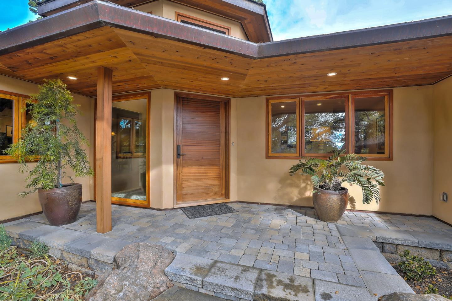 24651 Cabrillo Street Carmel, CA 93923 - Photo 7 of 42 a view of a entryway door back yard of the house