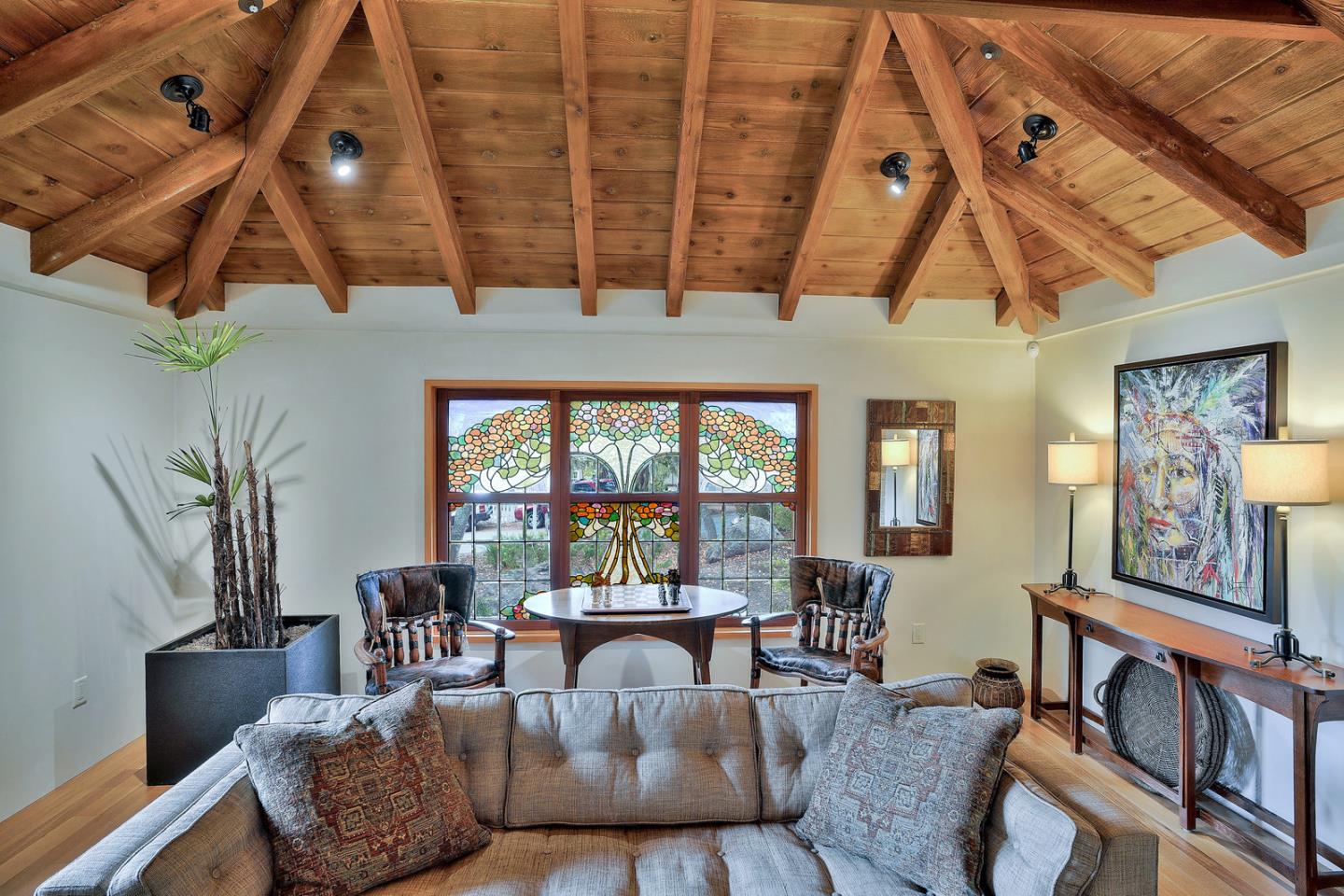 24651 Cabrillo Street Carmel, CA 93923 - Photo 9 of 42 a living room with furniture and a large window