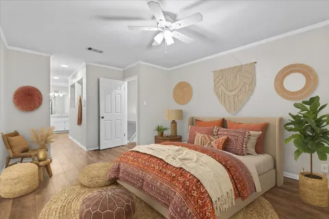 a spacious bedroom with a bed and cabinets