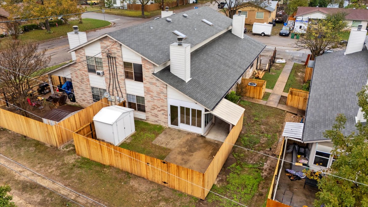 201 East Noton Street, Unit 104 Pflugerville, TX 78660 - Photo 32 of 35 an aerial view of residential houses with outdoor space