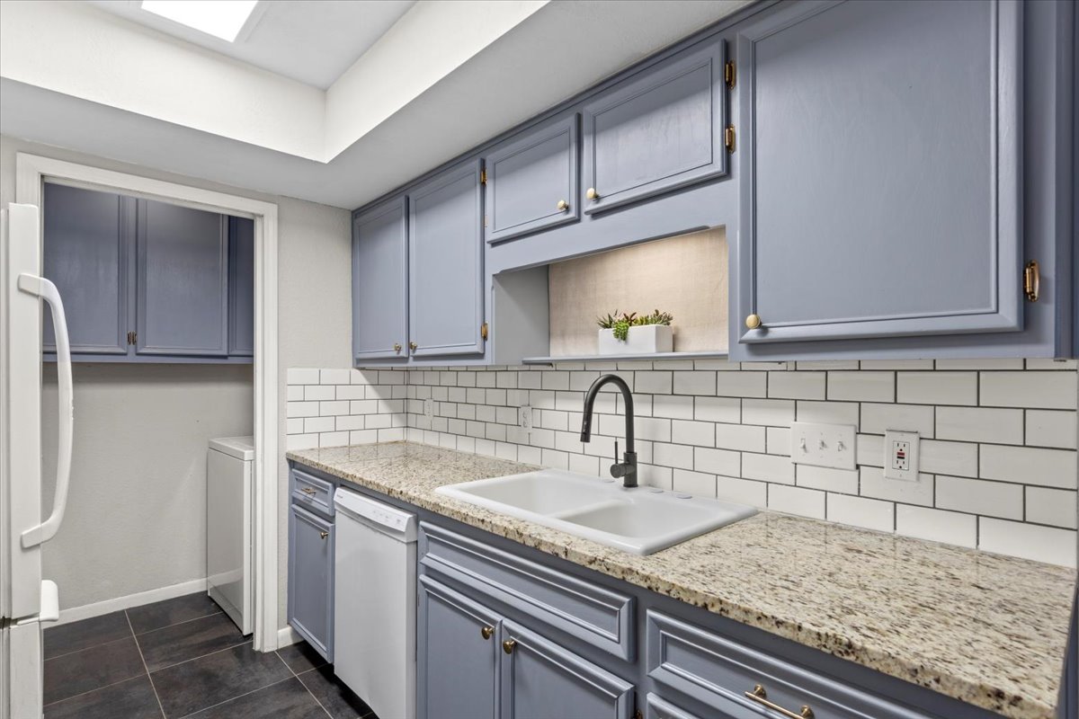 201 East Noton Street, Unit 104 Pflugerville, TX 78660 - Photo 10 of 35 a kitchen with a sink and cabinets