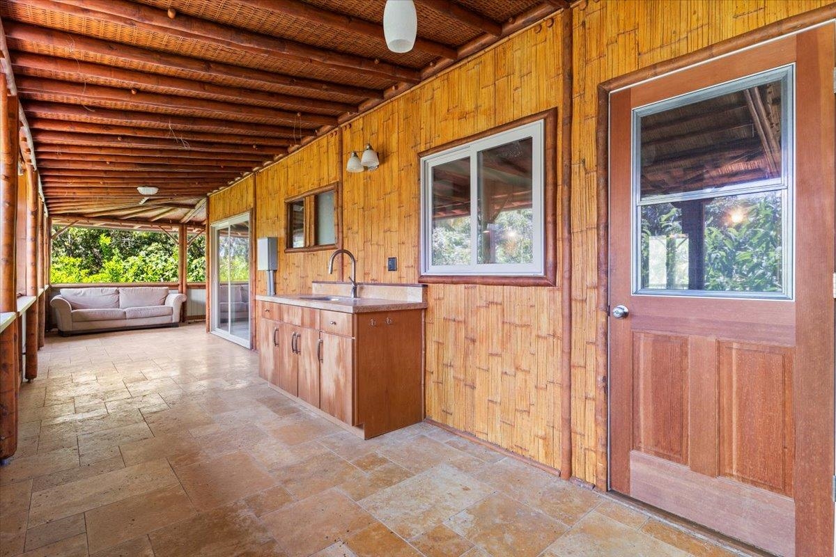 590 East Kuiaha Road Haiku, HI 96708 - Photo 23 of 42 a view of a porch with furniture and garden