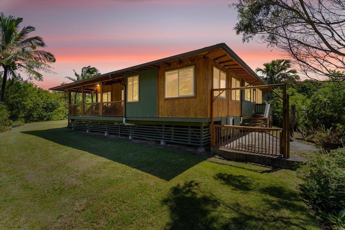 590 East Kuiaha Road Haiku, HI 96708 - Photo 3 of 42 a front view of a house with garden