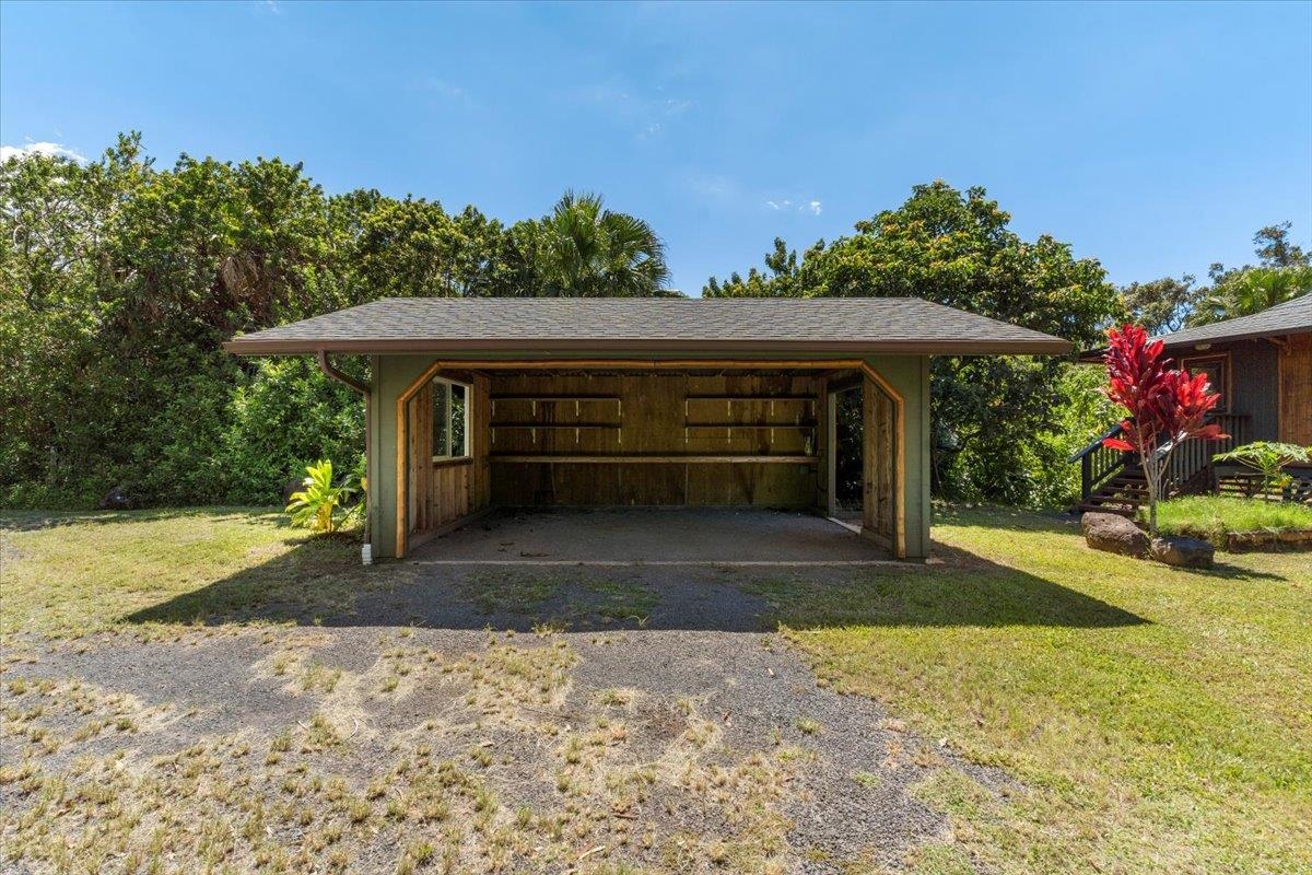 590 East Kuiaha Road Haiku, HI 96708 - Photo 33 of 42 a front view of a house with a yard