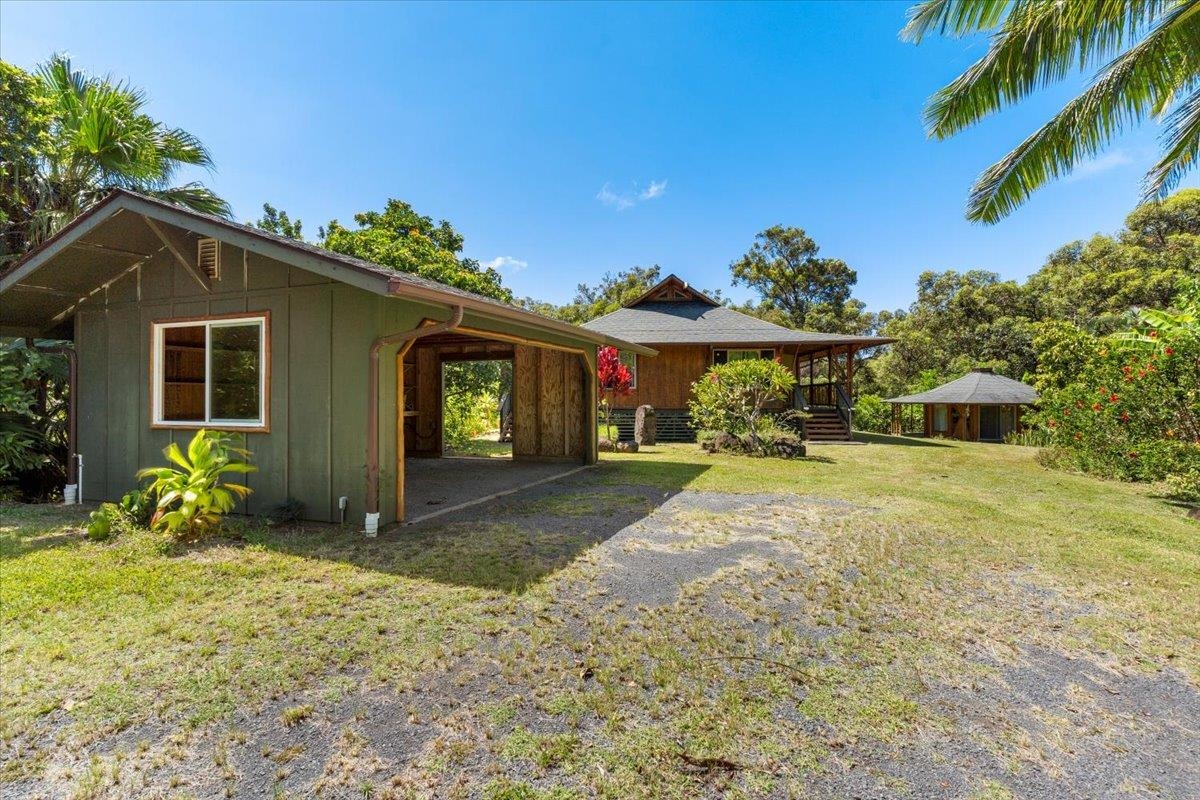590 East Kuiaha Road Haiku, HI 96708 - Photo 34 of 42 a view of a house with a yard and plants