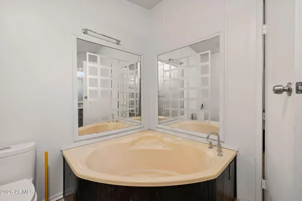 a bathroom with a shower and a sink
