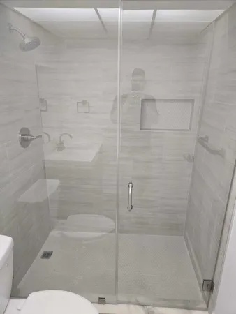 a bathroom with a bathtub and a toilet