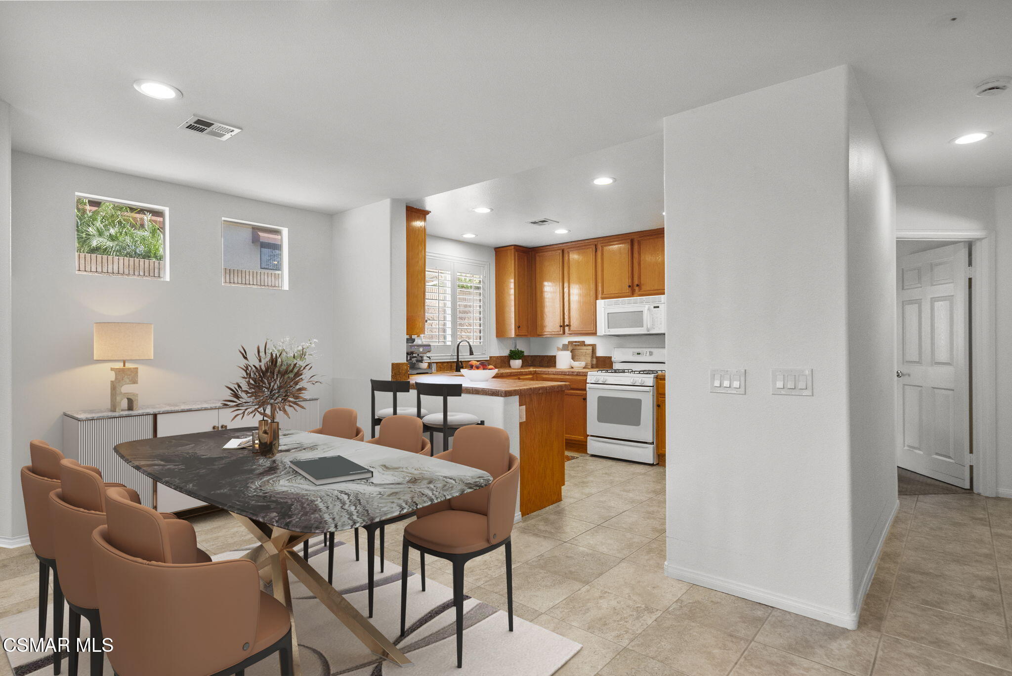 2046 Freesia Avenue Simi Valley, CA 93063 - Photo 15 of 33 a kitchen with a table and chairs in it