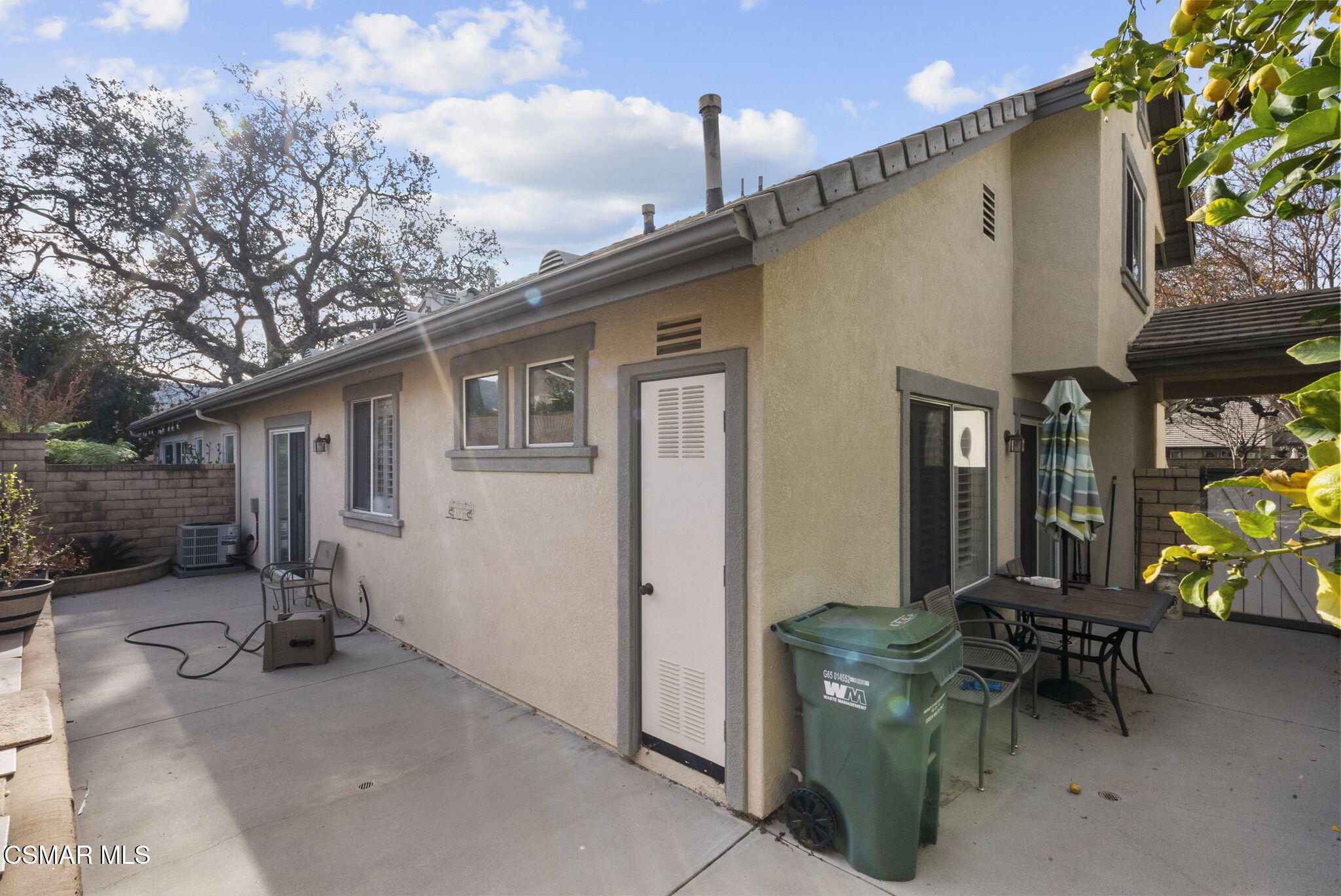2046 Freesia Avenue Simi Valley, CA 93063 - Photo 28 of 33 a view of a patio with table and chairs under an umbrella