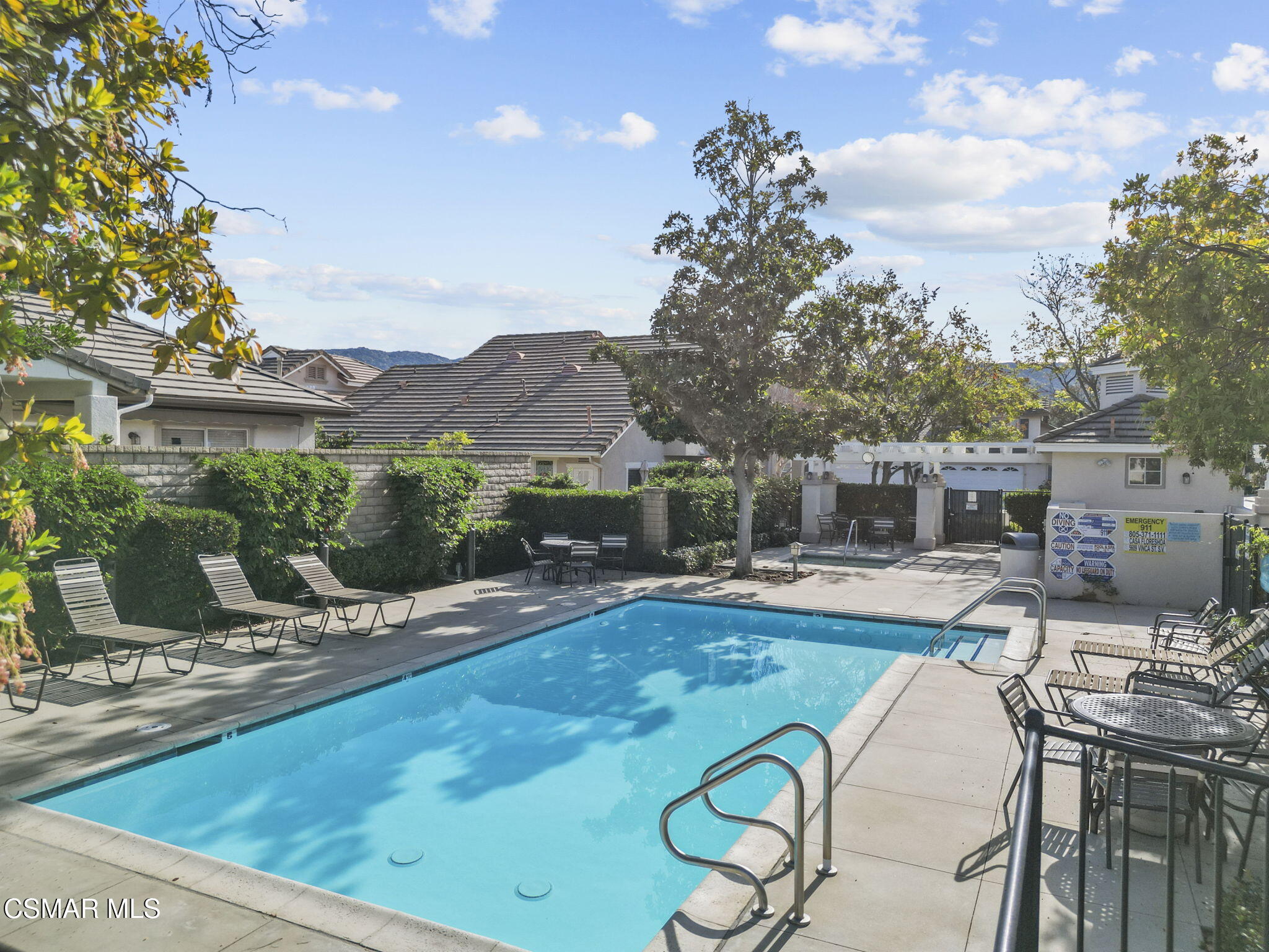 2046 Freesia Avenue Simi Valley, CA 93063 - Photo 31 of 33 a view of a patio with table and chairs under an umbrella