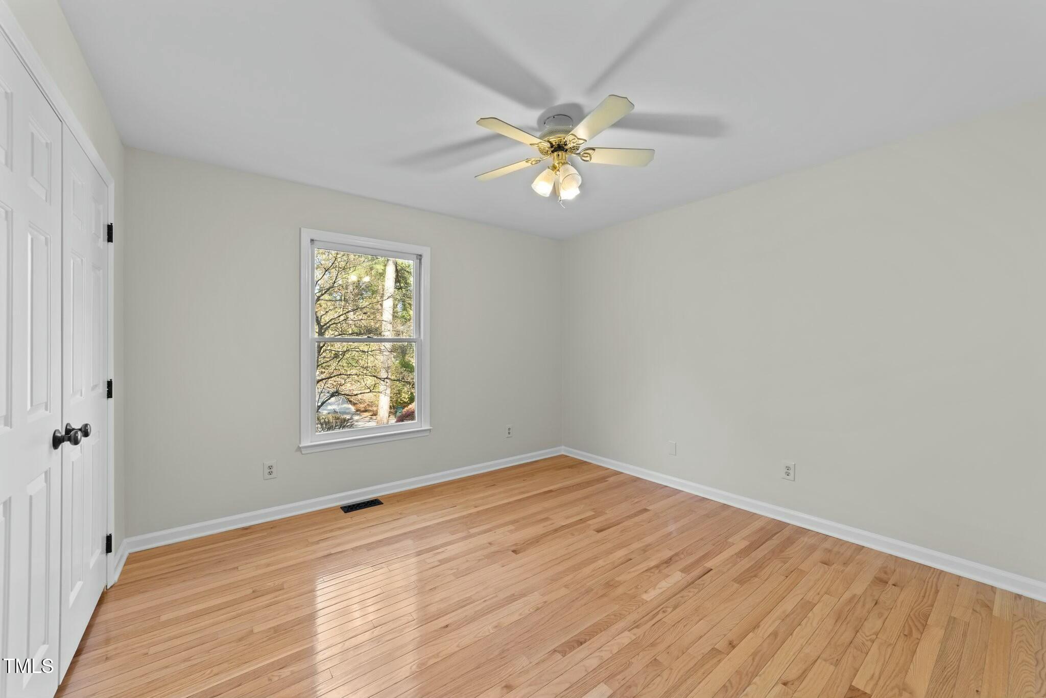 5809 Heatherbrook Circle Raleigh, NC 27612 - Photo 23 of 42 Second bedroom with ceiling fan and good size closet.