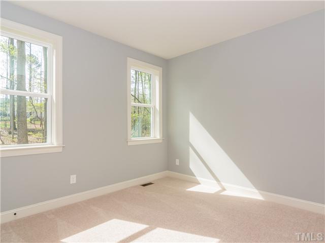 7113 Carries Reach Way, Unit 4 Raleigh, NC 27614 - Photo 15 of 25 1st floor guest bedroom