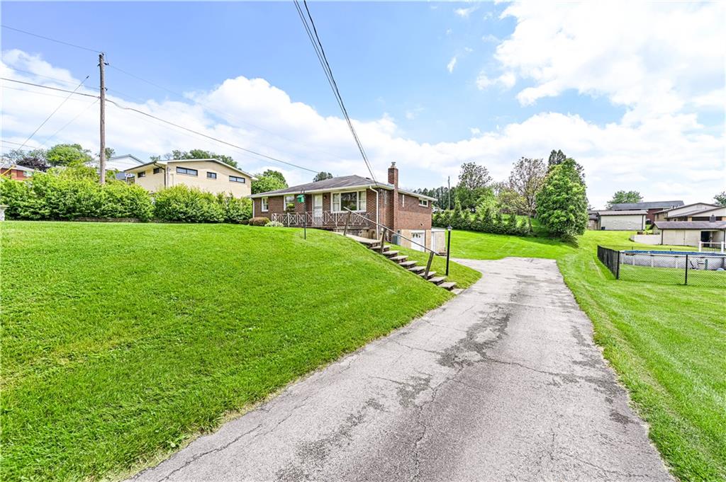 13740 Ridge Road Irwin, PA 15642 - Photo 33 of 43 a view of a garden with a house in the background