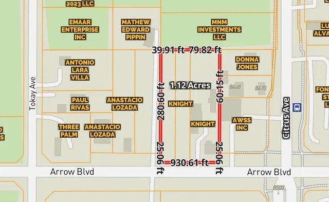 a white refrigerator sitting next to a white wall