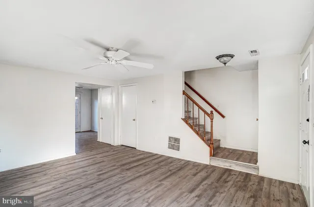 a view of an entryway with wooden floor