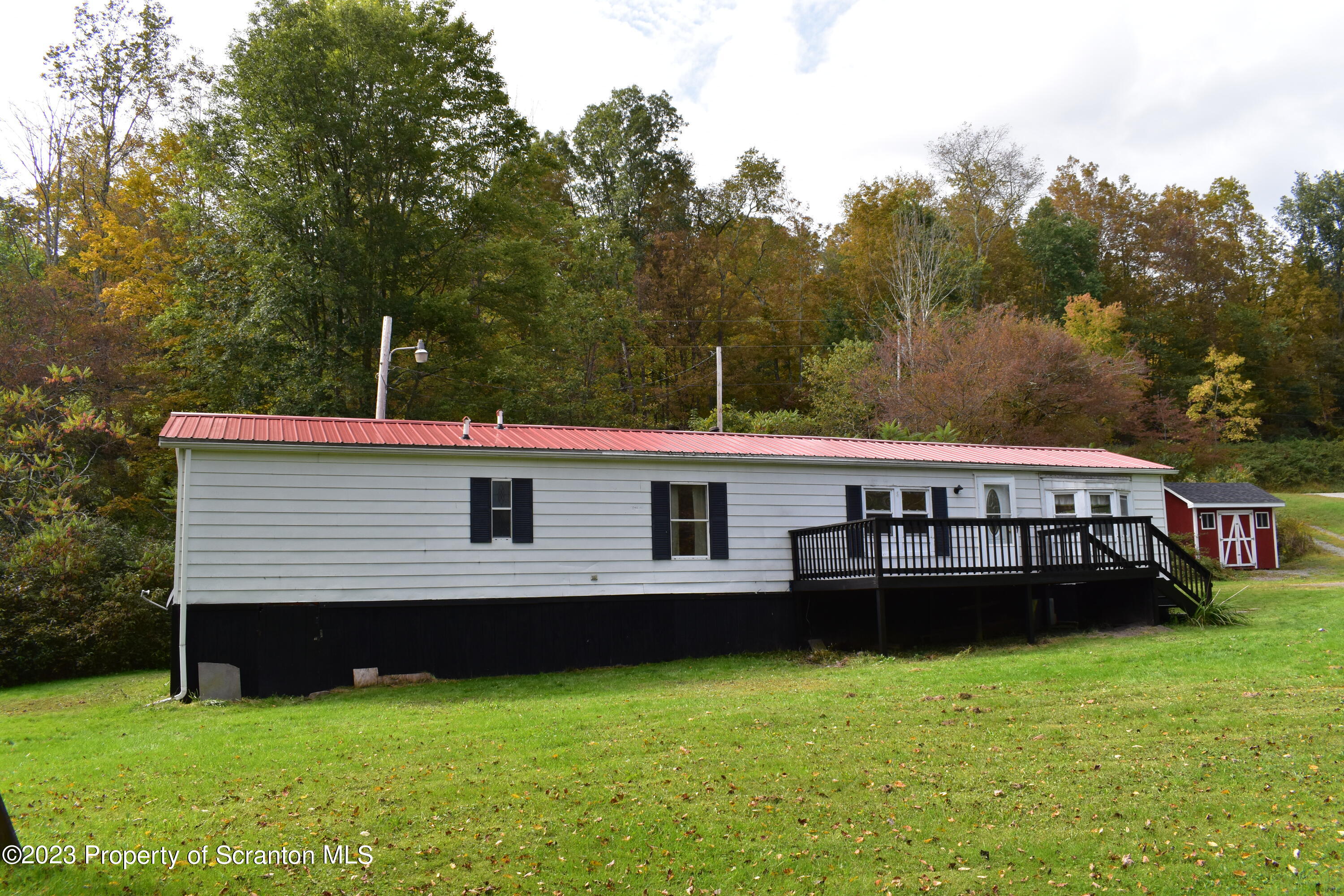 1258 Jennings Road Springville, PA 18844 - Photo 1 of 32 a view of a house with a backyard and a sitting area