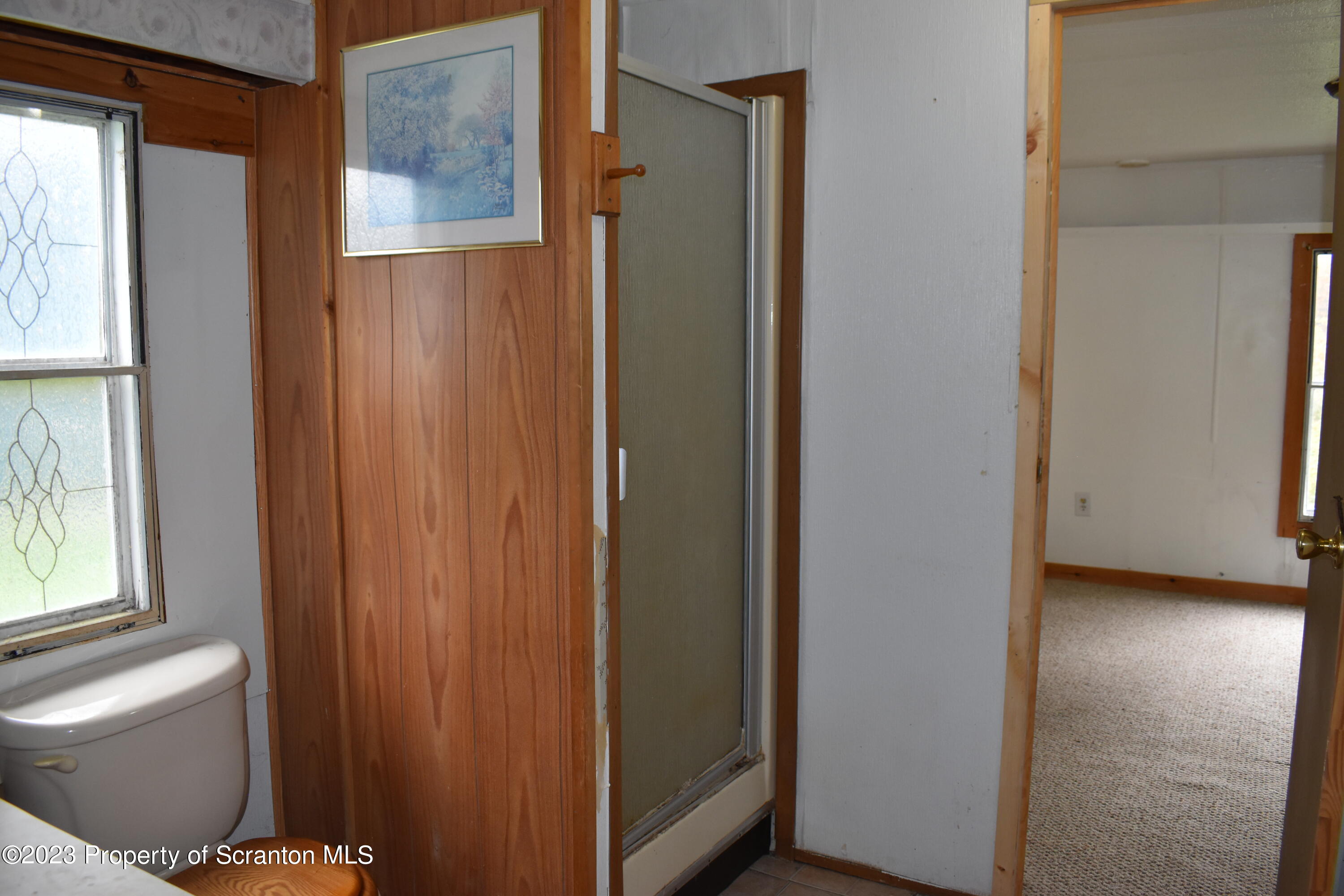 1258 Jennings Road Springville, PA 18844 - Photo 16 of 32 a view of a bathroom with a shower and a sink
