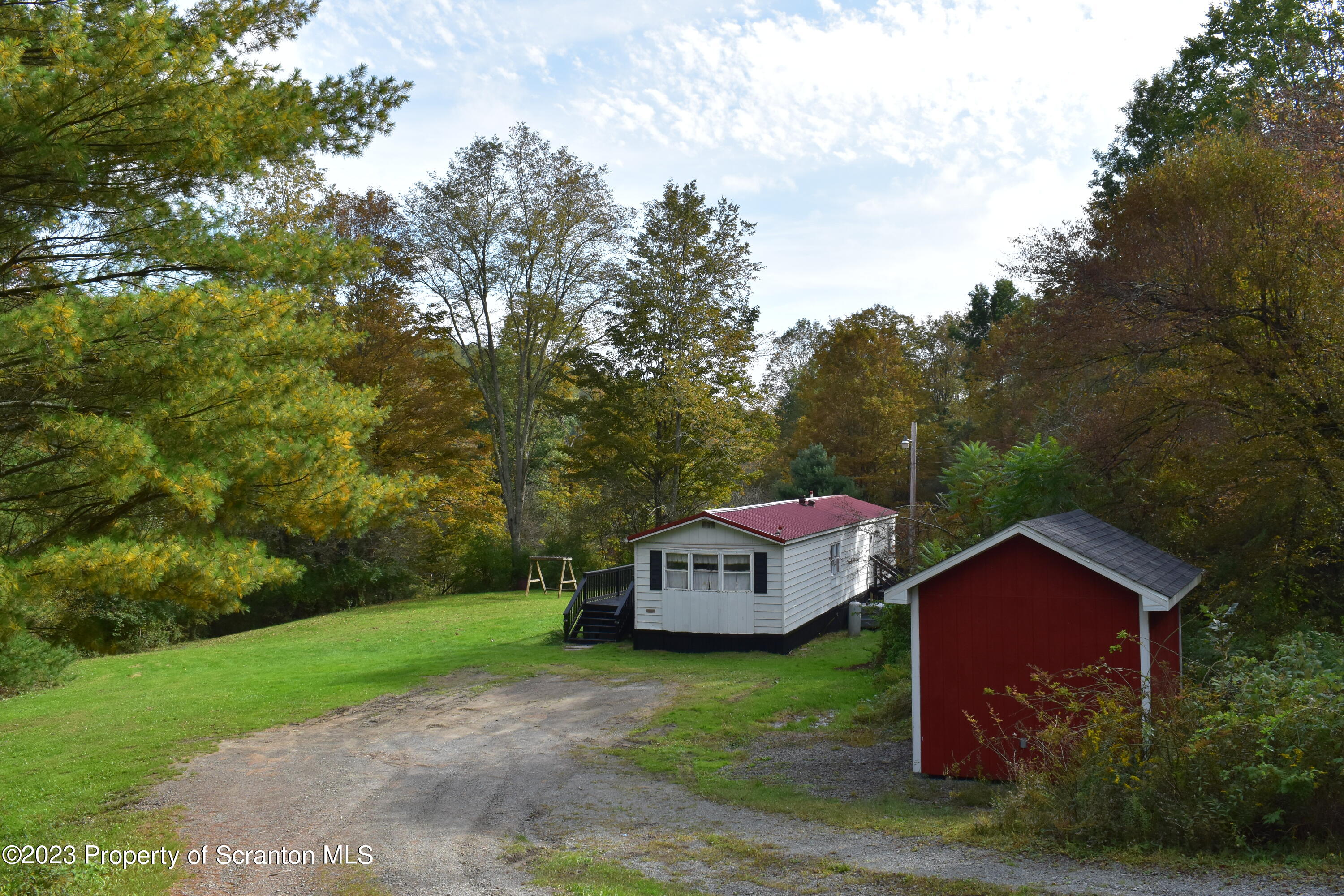 1258 Jennings Road Springville, PA 18844 - Photo 27 of 32 a house that has tree in front of it