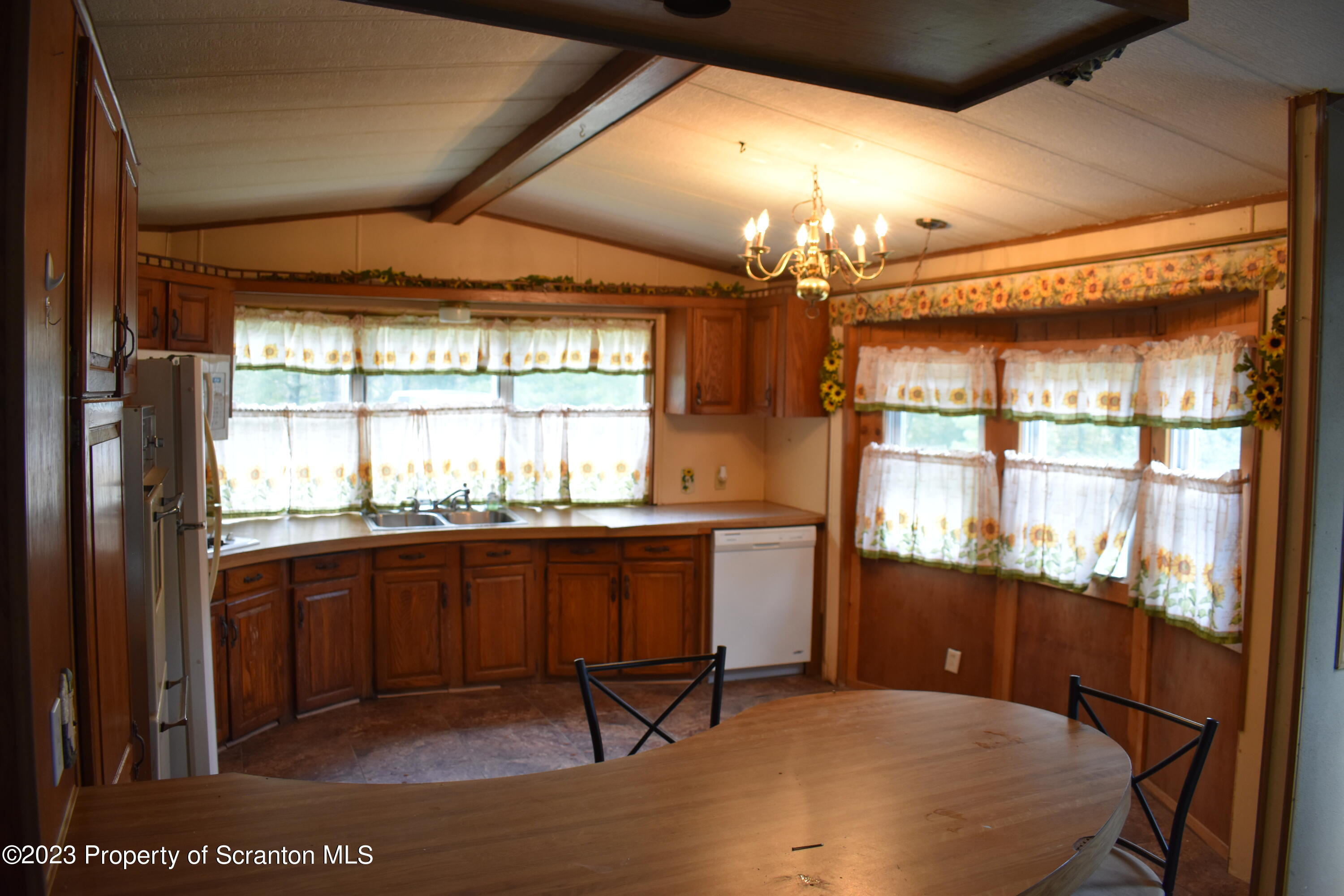 1258 Jennings Road Springville, PA 18844 - Photo 7 of 32 a room with granite countertop furniture and a large window