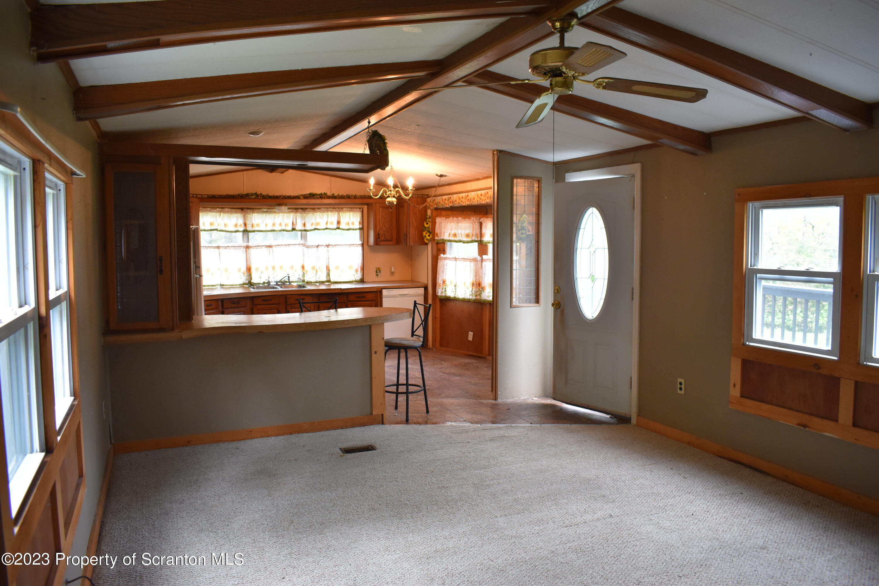 1258 Jennings Road Springville, PA 18844 - Photo 10 of 32 a view of livingroom with window and hardwood floor