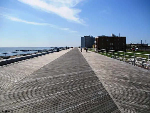 a view of a terrace with wooden floor and city view