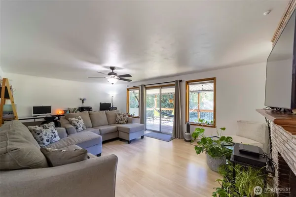 a room with furniture gym equipment and view of living room