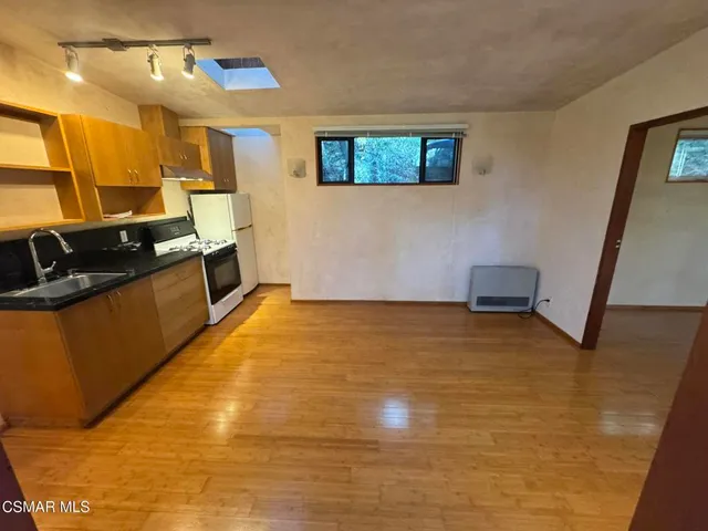 a view of a kitchen with a sink