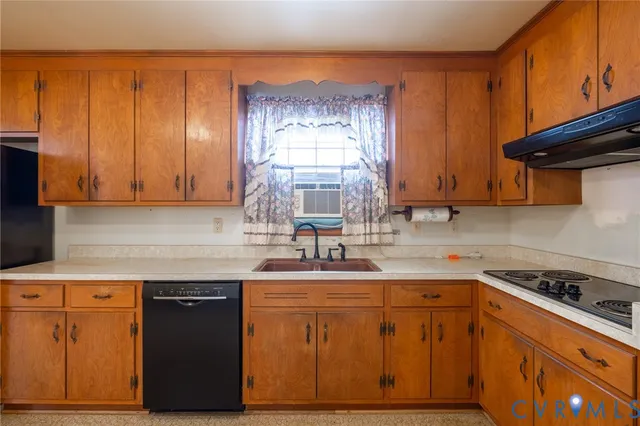 a kitchen with stainless steel appliances granite countertop a sink a stove and a microwave