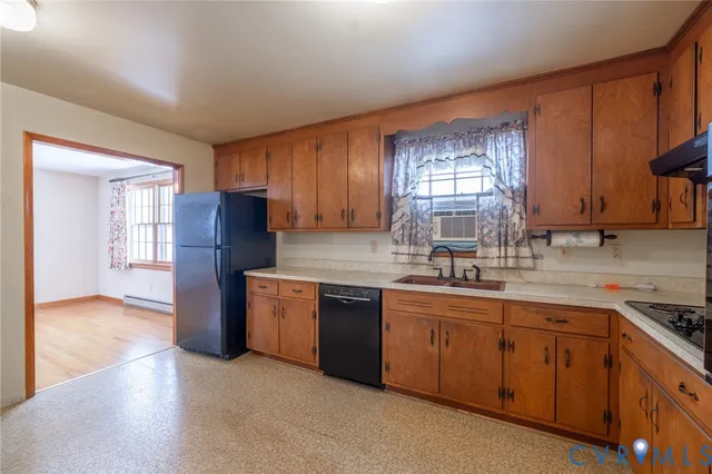 a kitchen with stainless steel appliances granite countertop a refrigerator sink and cabinets