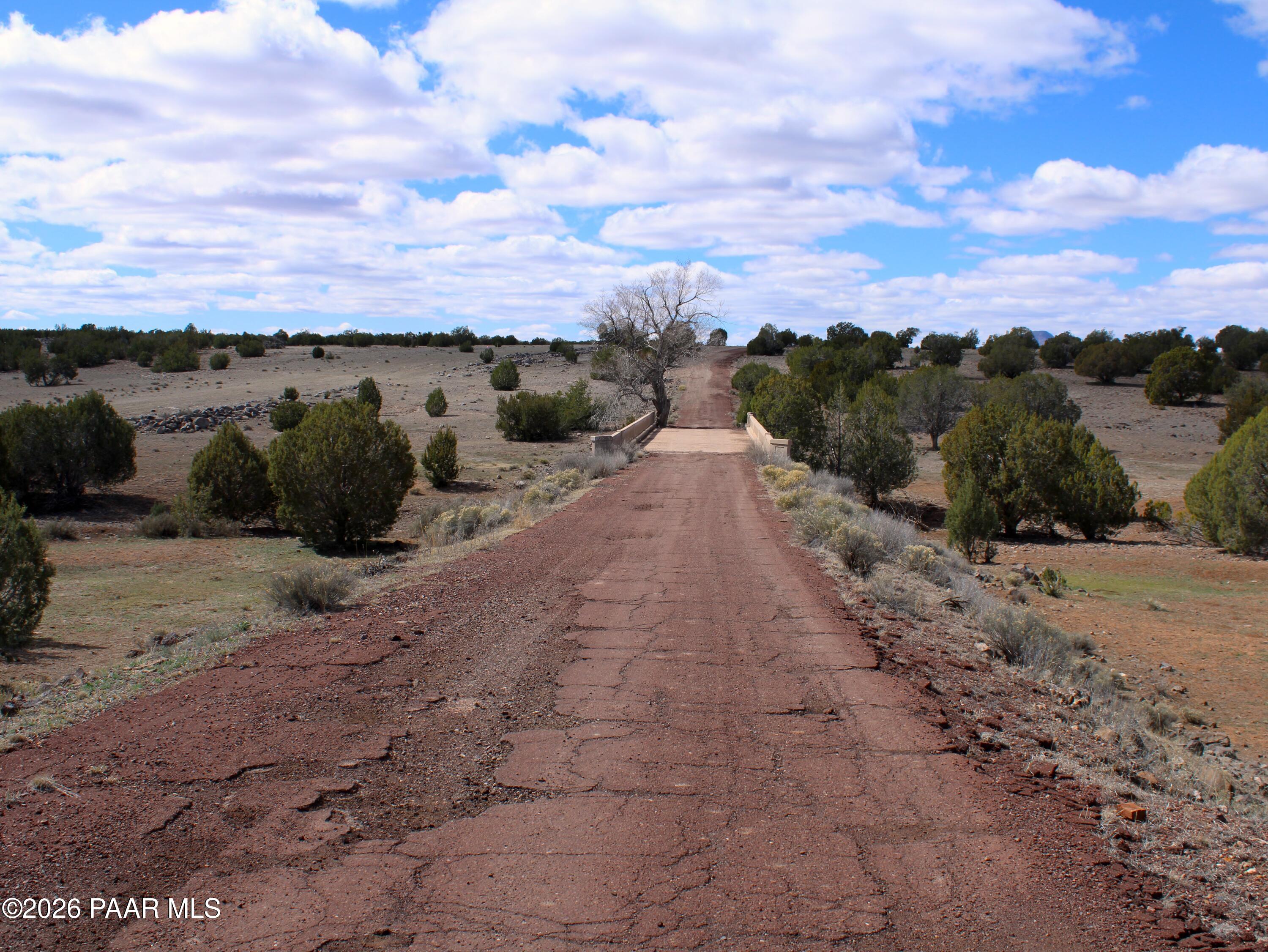294 Crimson Hill Road Ash Fork, AZ 86320 - Photo 11 of 11 a view of a road with an ocean