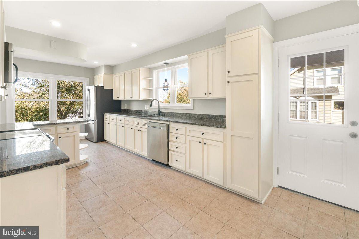 26618 Ridge Road Damascus, MD 20872 - Photo 20 of 65 Cream colored cabinets and door to outside
