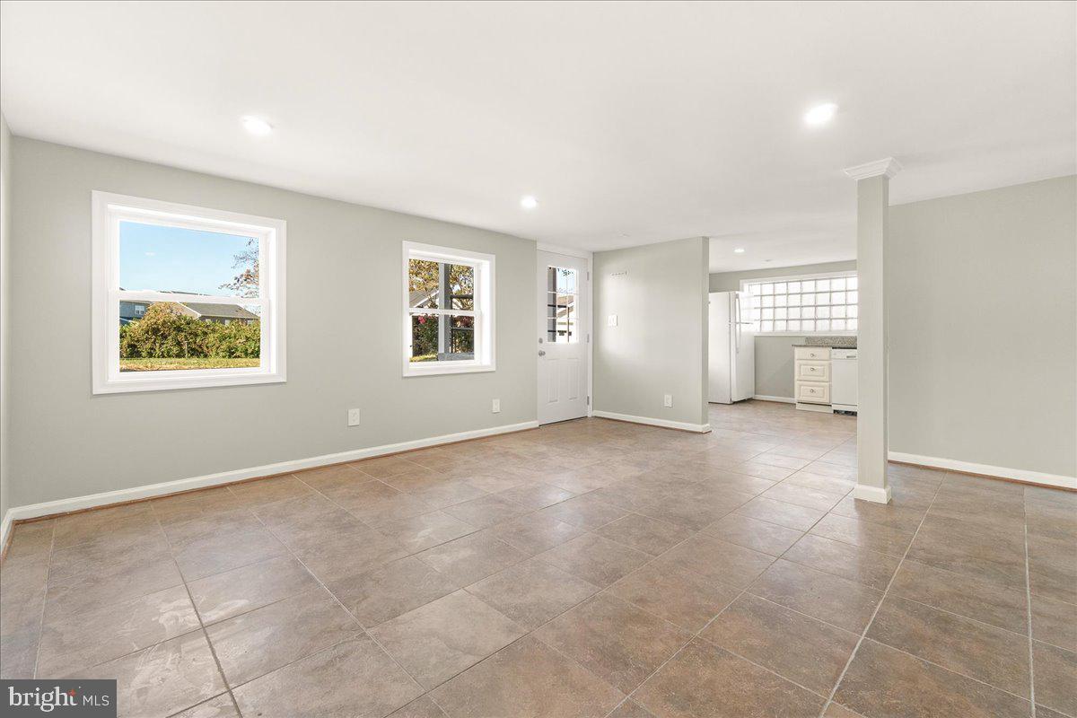 26618 Ridge Road Damascus, MD 20872 - Photo 42 of 65 Basement Living Space with Door Outside