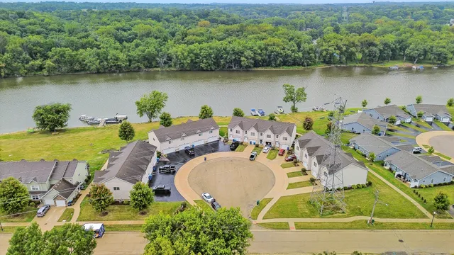 an aerial view of a house with a lake view
