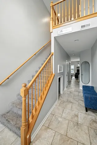 a view of a hallway with windows