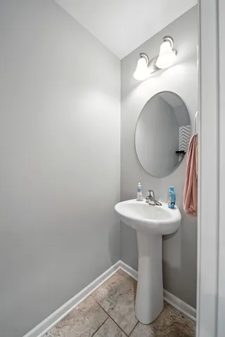 a view of a hallway with stairs